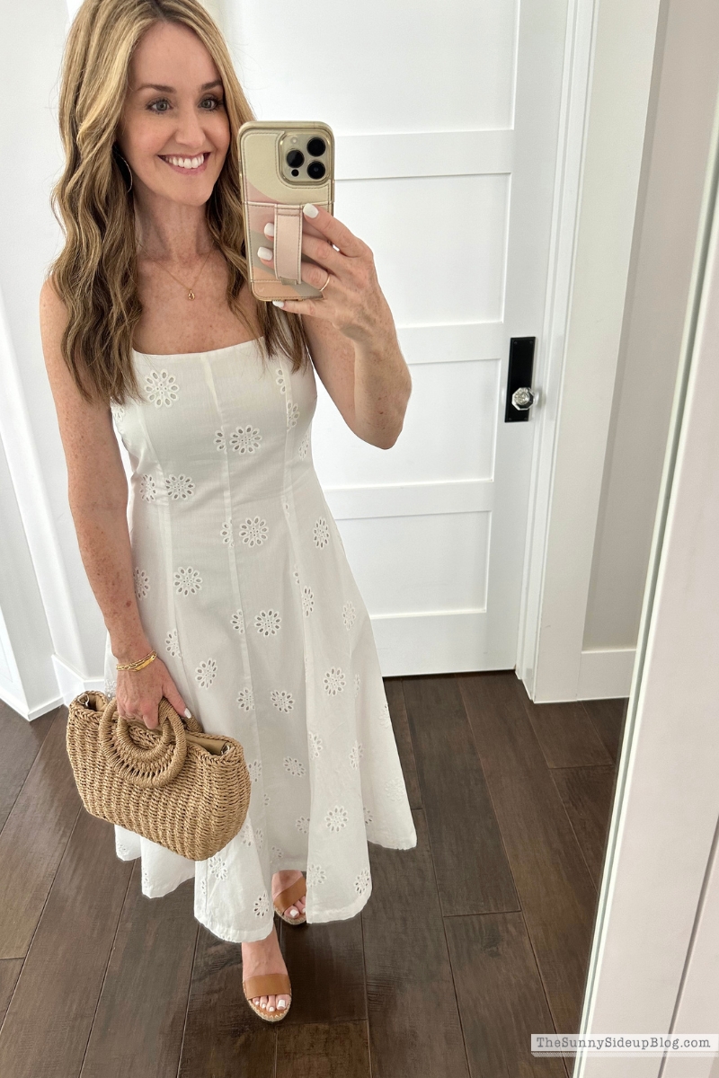 White strapless midi dress and woven summer handbag